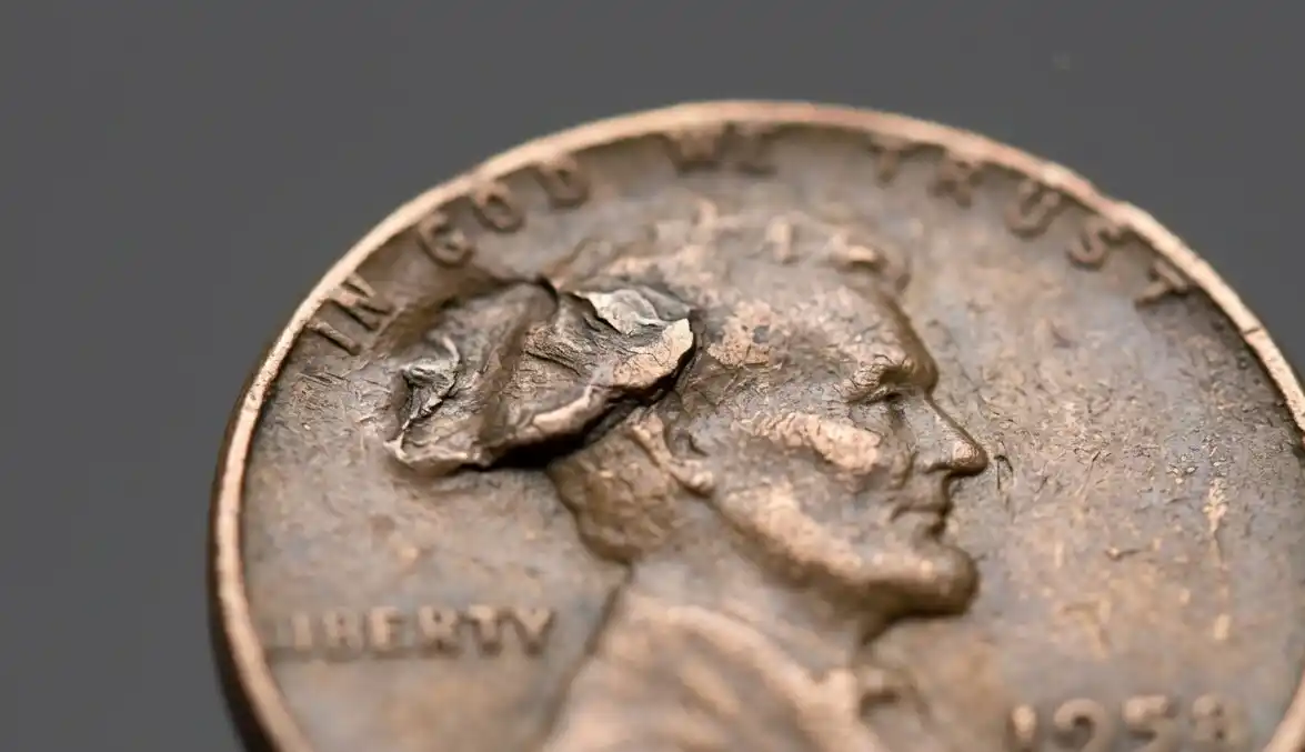 Macro close-up of a 1958 wheat penny error